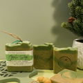 Green Apple handmade soap bars by Espuma Apothecary displayed on a light green surface with subtle decorative accents.